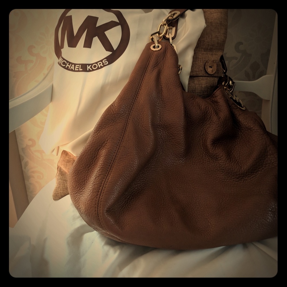Michael Kors hobo purse with dust cloth.